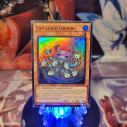 A Super Rare "Yamatako Orochi" card from the Yugioh 25th Anniversary Tin: Dueling Heroes set.