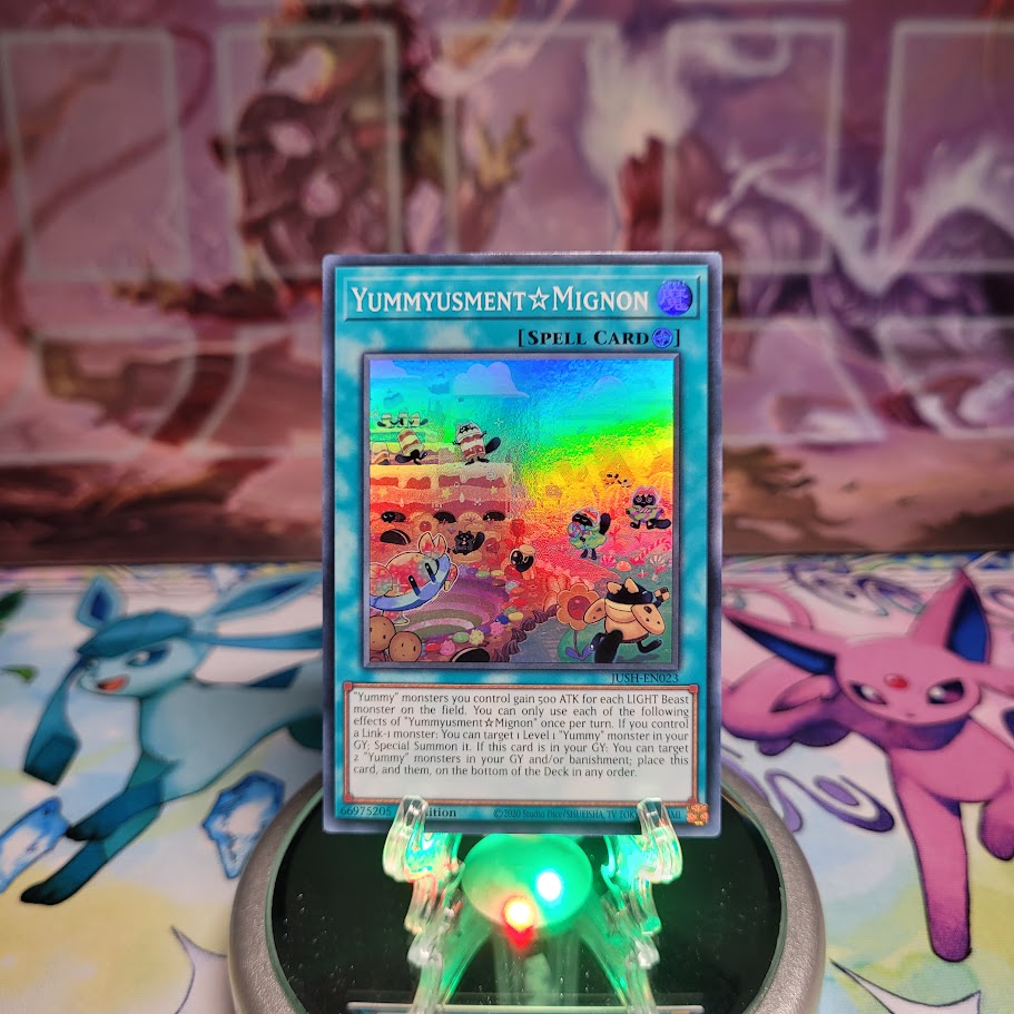 A Super Rare "Yummyusment Mignon" card from the Yugioh Set: Justice Hunters (JUSH).