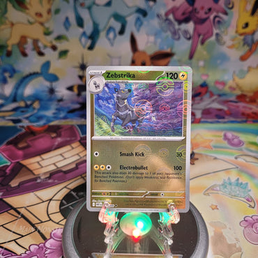 A Poke Ball Pattern Rare "Zebstrika" (032/086) card from the Pokemon Set: Scarlet & Violet: White Flare (WHT).