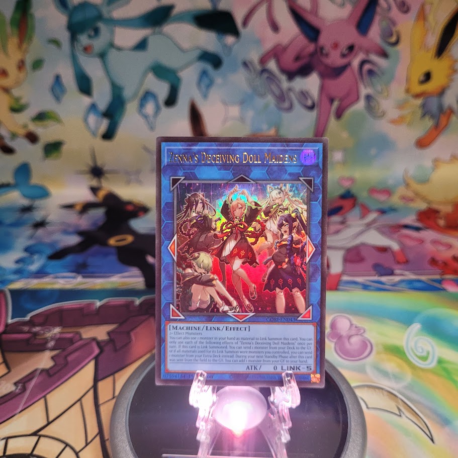 An Ultra Rare "Zenna's Deceiving Doll Maidens" Card from the Yugioh Set: Chaos Origins (CORI).