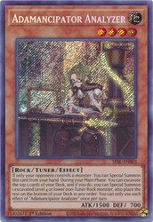  A Secret Rare "Adamancipator Analyzer" card from the Yugioh Set: Secret Slayers.