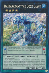 A Secret Rare "Daidaratant the Ooze Giant" card from the Yugioh Set: Battles of Legend: Monstrous Revenge (BLMR).
