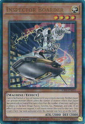 A Prismatic Ultimate Rare "Inspector Boarder" card from the Yugioh Set: Rarity Collection 1 (RA01).